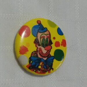 Strange & unusual vintage button pin featuring a clown